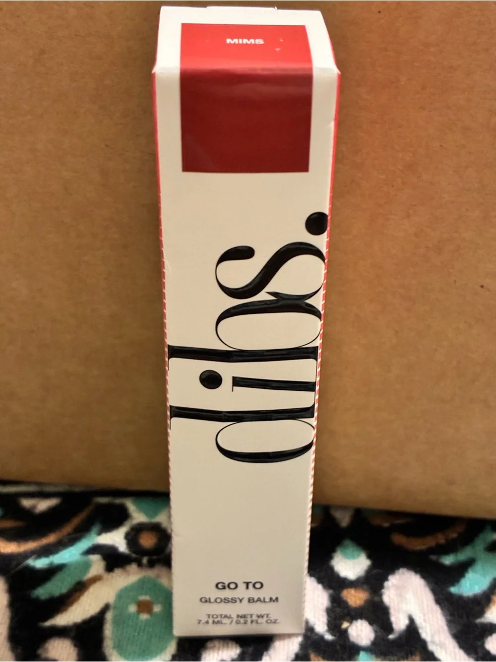 Dibs Go To Glossy Balm in shade mims